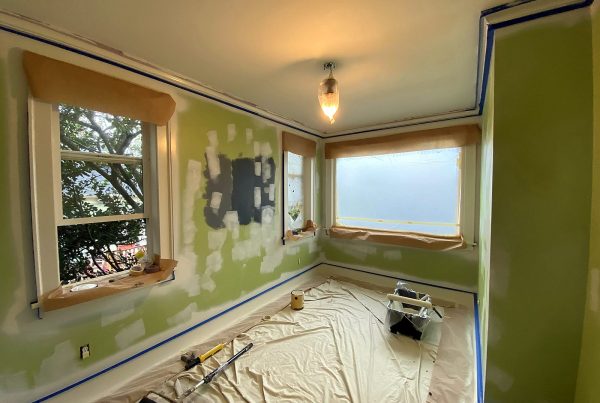 Interior paint prep around window trim, patches feathered and ready for primer