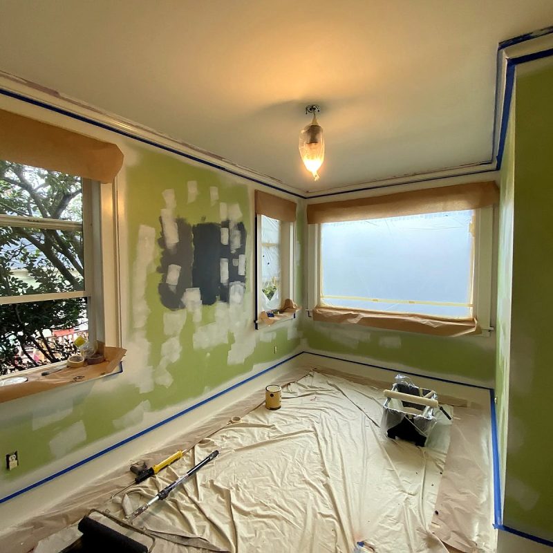 Interior paint prep around window trim, patches feathered and ready for primer